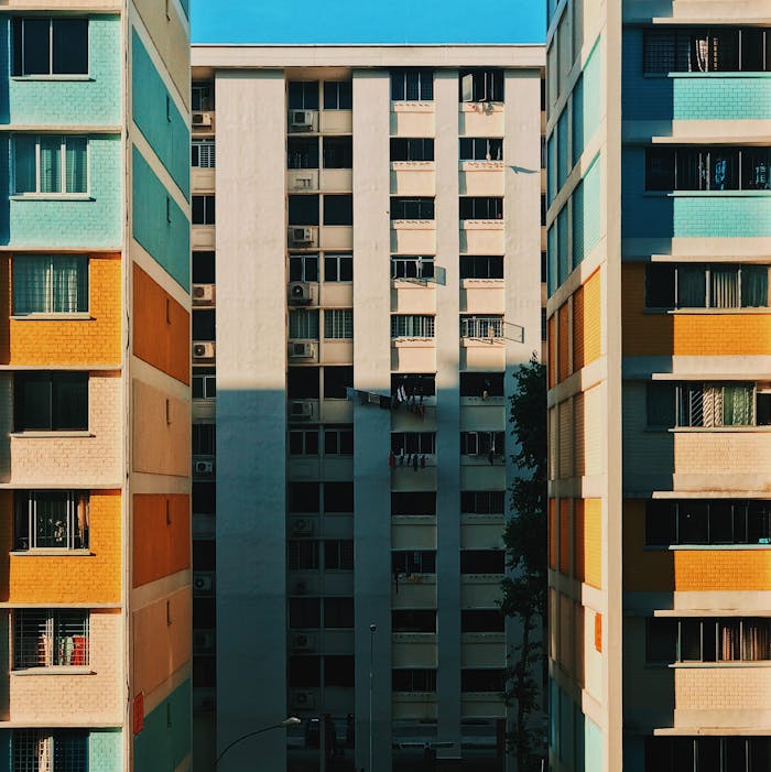 Services Vibrant facade of urban residential buildings in Singapore, capturing a geometric pattern.